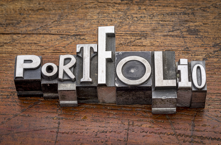 portfolio  word in mixed vintage metal type printing blocks over